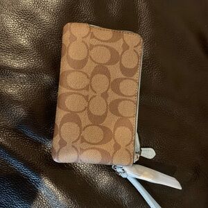 Brand new never used. Coach Wristlet